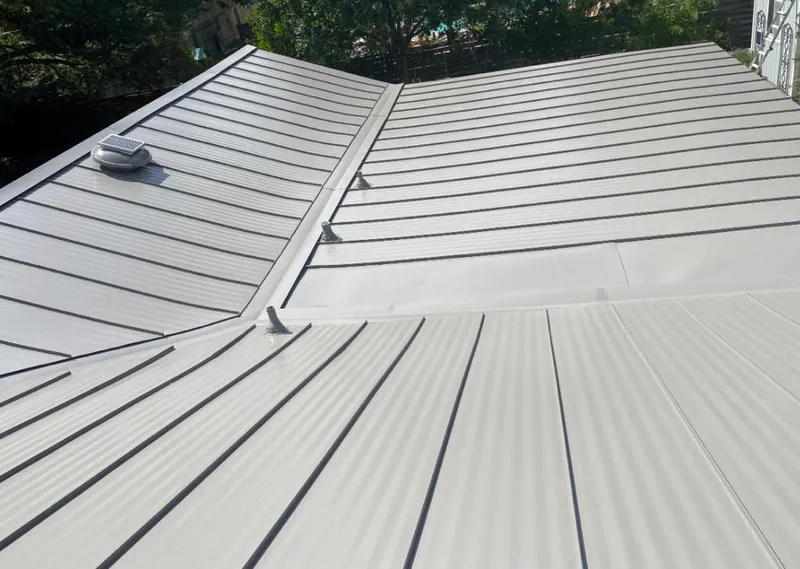Solar attic fan installed on a metal roof for Roof Ventilation in Catskill
